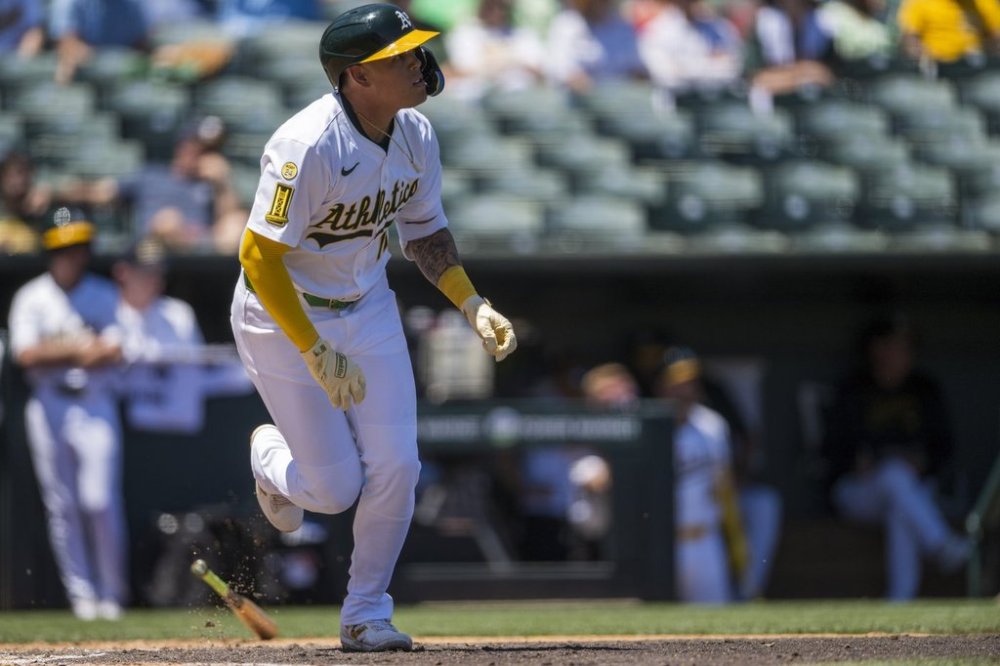 Athletics' Gio Urshela (13) watches his hit during the third inning of a baseball game against the Los Angeles Angels in West Sacramento, Calif., Thursday, May 22, 2025. (AP Photo/Nic Coury)