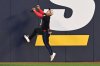Toronto Blue Jays centre-fielder Daulton Varsho (5) climbs the wall in an unsuccessful attempt to catch a solo home run by Detroit Tigers' Riley Greene during second inning American League baseball action in Toronto on Friday, May 16, 2025. THE CANADIAN PRESS/Jon Blacker