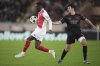 FILE - Monaco's Folarin Balogun, left, controls a ball chased by Benfica's Tomas Araujo during a Champions League opening phase soccer match at the Louis II stadium in Monaco, Wednesday, Nov. 27, 2024. (AP Photo/Laurent Cipriani, File)
