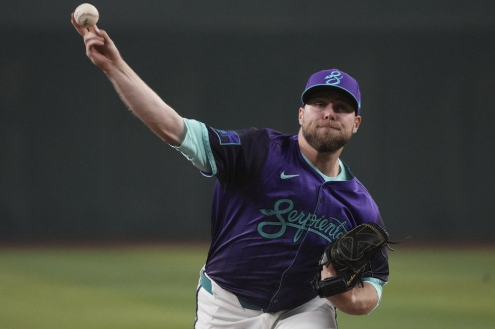 Arizona Diamondbacks pitcher Corbin Burnes throws against the Los Angeles Dodgers in the first inning during a baseball game, Saturday, May 10, 2025, in Phoenix. (AP Photo/Rick Scuteri)