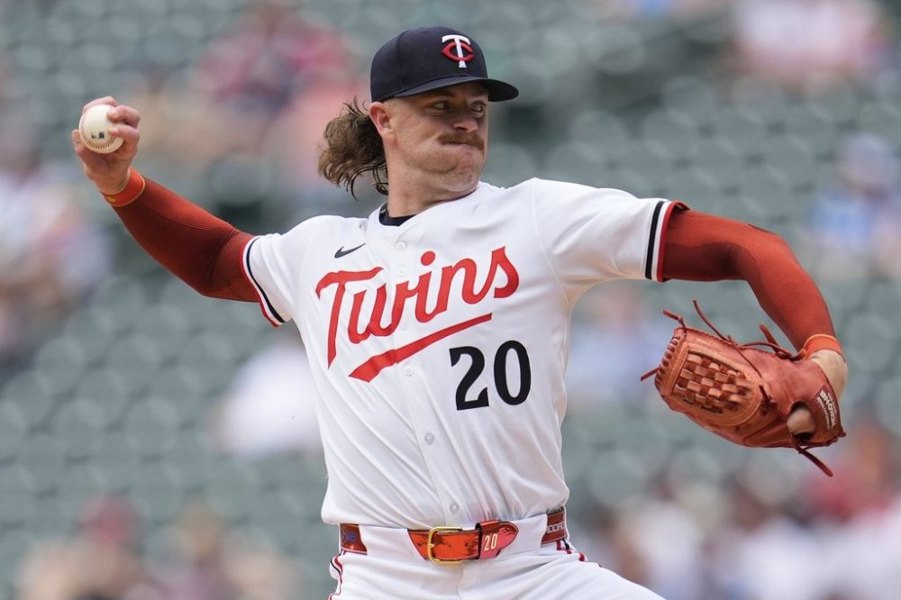 Minnesota Twins starting pitcher Chris Paddack (20) delivers during the second inning of a baseball game against the Toronto Blue Jays, Saturday, June 7, 2025, in Minneapolis. (AP Photo/Abbie Parr)