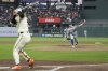 Kansas City Royals pitcher Kris Bubic (50) throws a pitch to San Francisco Giants' Jung Hoo Lee, left, during the sixth inning of a baseball game in San Francisco, Monday, May 19, 2025. (AP Photo/Jeff Chiu)