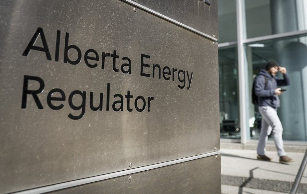 A person walks past the offices of the Alberta Energy Regulator in Calgary, Thursday, March 20, 2025.THE CANADIAN PRESS/Jeff McIntosh