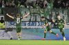 Wolfsburg's Jonas Wind, middle celebrates scoring a goal during the Bundesliga soccer match between VfL Wolfsburg and TSG 1899 Hoffenheim at Volkswagen Arena in Wolfsburg, Germany, Friday May 9, 2025. (Swen Pförtner/dpa via AP)