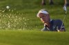 Luke Donald, of England, hits from the bunker on the first hole during the first round of the PGA Championship golf tournament at the Quail Hollow Club, Thursday, May 15, 2025, in Charlotte, N.C. (AP Photo/George Walker IV)