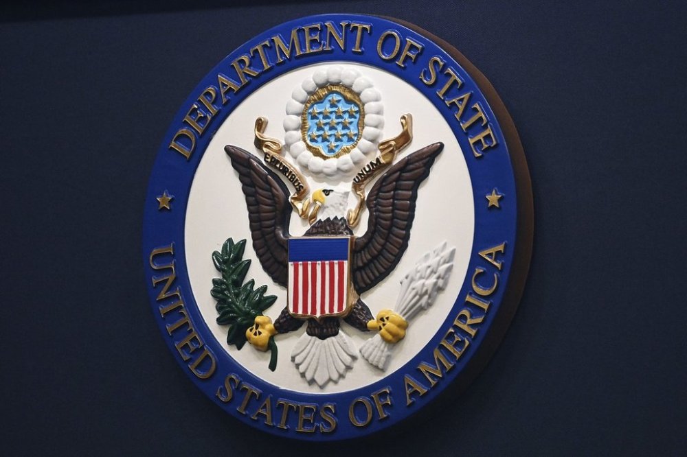 FILE - The State Department seal is seen on the briefing room lectern at the State Department in Washington, Jan. 31, 2022.(Mandel Ngan, Pool via AP, File)
