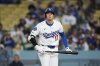 Los Angeles Dodgers' Shohei Ohtani reacts after striking out during the eighth inning of a baseball game against the Athletics, Thursday, May 15, 2025, in Los Angeles. (AP Photo/Mark J. Terrill)