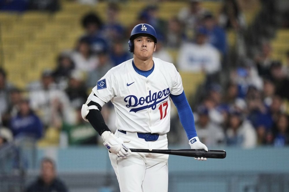 Los Angeles Dodgers' Shohei Ohtani reacts after striking out during the eighth inning of a baseball game against the Athletics, Thursday, May 15, 2025, in Los Angeles. (AP Photo/Mark J. Terrill)