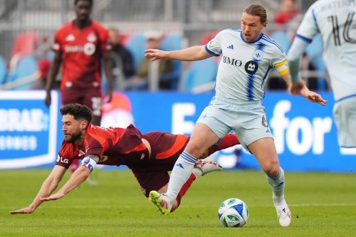CF Montreal's Samuel Piette (right) knocks Toronto FC's Jonathan Osorio (21) off the ball during first-half Canadian Championship preliminary round soccer action in Toronto on Wednesday, April 30, 2025. THE CANADIAN PRESS/Frank Gunn