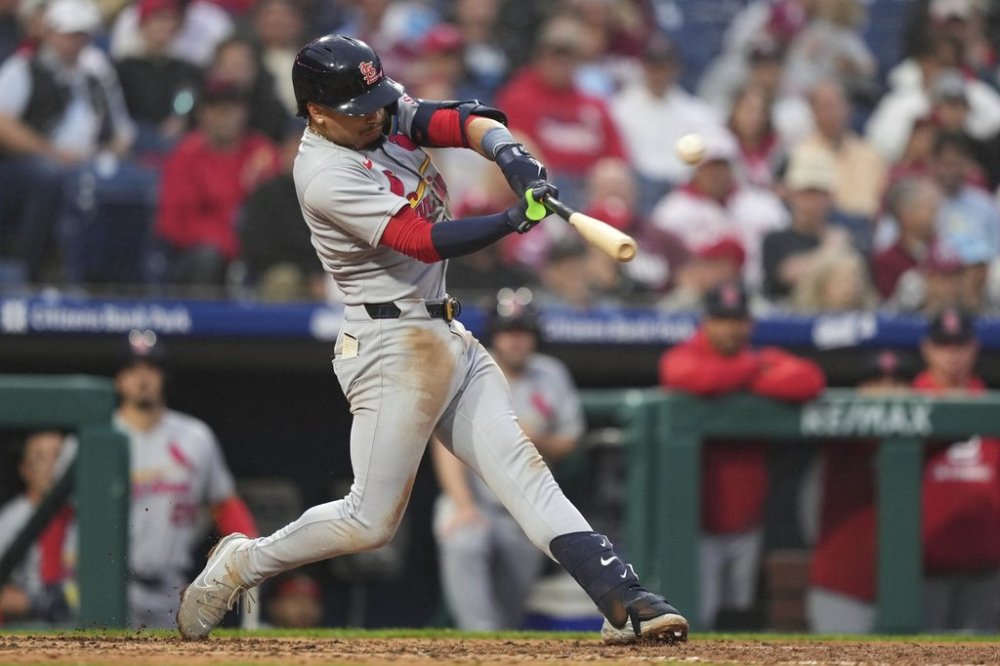 St. Louis Cardinals' Masyn Winn hits ahome run against Philadelphia Phillies pitcher Aaron Nola during the fourth inning in the second baseball game of a doubleheader Wednesday, May 14, 2025, in Philadelphia. (AP Photo/Matt Slocum)