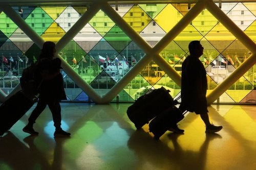 Travellers arrive at Miami International Airport, Thursday, June 5, 2025, in Miami, Fla. THE CANADIAN PRESS/AP, Marta Lavandier