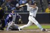 Tampa Bay Rays' Brandon Lowe watches his RBI double off Texas Rangers pitcher Kumar Rocker during the third inning of a baseball game Wednesday, June 4, 2025, in Tampa, Fla. (AP Photo/Chris O'Meara)