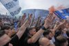 Napoli fans gather outside Diego Maradona stadium where the decisive match for the Italian Serie A soccer championship title Napoli versus Cagliari is scheduled to be played in Naples, Italy, Friday, May 23, 2025. (AP Photo/Gregorio Borgia)