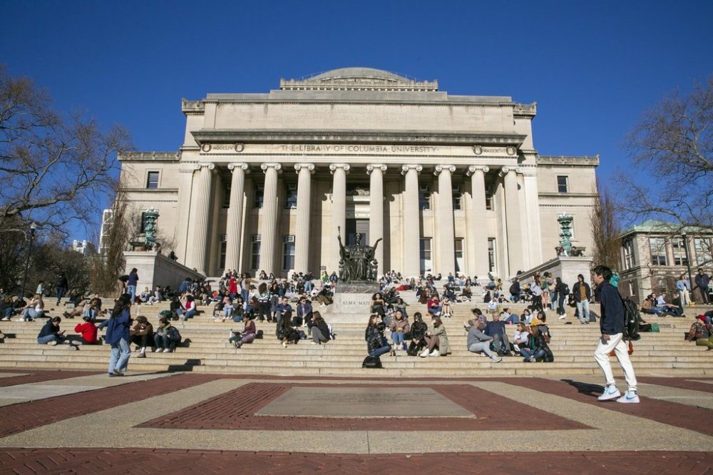 FILE - Students sit on the front steps of Low Memorial Library on the Columbia University campus in New York City, Feb. 10, 2023. (AP Photo/Ted Shaffrey, File)