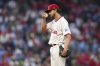 Philadelphia Phillies pitcher Aaron Nola wipes his face during the fourth inning in the second baseball game of a doubleheader against the St. Louis Cardinals Wednesday, May 14, 2025, in Philadelphia. (AP Photo/Matt Slocum)