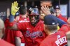Atlanta Braves' Ronald Acuna Jr. celebrates in the dugout after hitting a home run in the first inning of a baseball game against the San Diego Padres, Friday, May 23, 2025, in Atlanta. (AP Photo/Colin Hubbard)