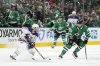 FILE - Edmonton Oilers center Connor McDavid (97) works to get the puck past Dallas Stars center Wyatt Johnston (53) during the first period of Game 1 of the Western Conference finals in the NHL hockey Stanley Cup playoffs, May 23, 2024, in Dallas. (AP Photo/Tony Gutierrez, File)