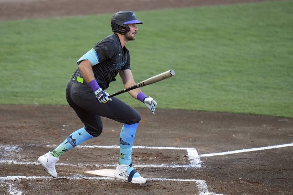 Tampa Bay Rays' Josh Lowe watches his double off Toronto Blue Jays pitcher Eric Lauer during the second inning of a baseball game Friday, May 23, 2025, in Tampa, Fla. (AP Photo/Chris O'Meara)