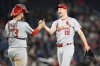 St. Louis Cardinals starter Erick Fedde (12) celebrates with catcher Pedro Pages, left, after pitching a complete shutout baseball game against the Washington Nationals, Friday, May 9, 2025, in Washington. (AP Photo/Nick Wass)