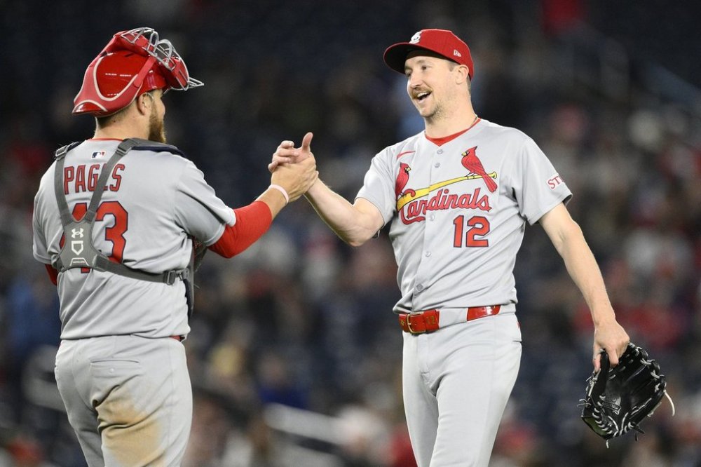 St. Louis Cardinals starter Erick Fedde (12) celebrates with catcher Pedro Pages, left, after pitching a complete shutout baseball game against the Washington Nationals, Friday, May 9, 2025, in Washington. (AP Photo/Nick Wass)
