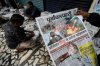 Vendors sort for distribution in Guwahati, India, news papers leading with reports of India firing missiles early Wednesday into Pakistani-controlled territory, Thursday, May 8, 2025. (AP Photo/Anupam Nath)