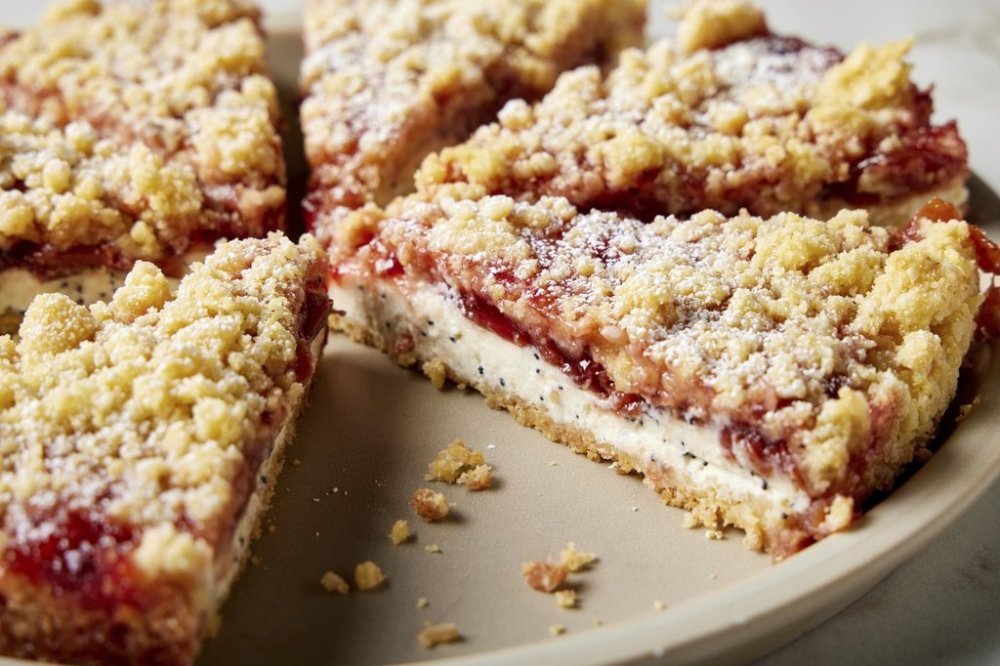 This image released by Milk Street shows a recipe for ricotta and cherry jam tarts. (Milk Street via AP)