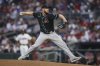 Arizona Diamondbacks pitcher Merrill Kelly delivers in the second inning of a baseball game against the Atlanta Braves, Wednesday, June 4, 2025, in Atlanta. (AP Photo/Colin Hubbard)