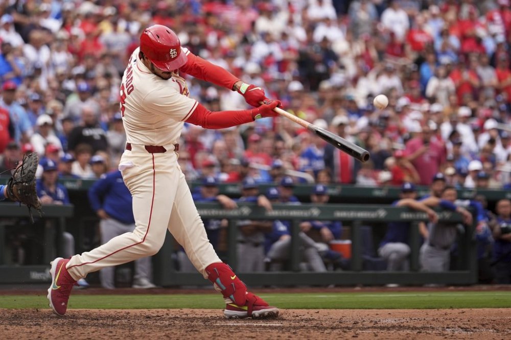 St. Louis Cardinals' Nolan Arenado hits a walk-off single to defeat the Los Angeles Dodgers in a baseball game Saturday, June 7, 2025, in St. Louis. (AP Photo/Jeff Roberson)