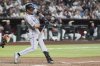 Colorado Rockies' Jordan Beck starts his swing on a two-run home run against the Arizona Diamondbacks during the seventh inning of a baseball game Saturday, May 17, 2025, in Phoenix. (AP Photo/Ross D. Franklin)