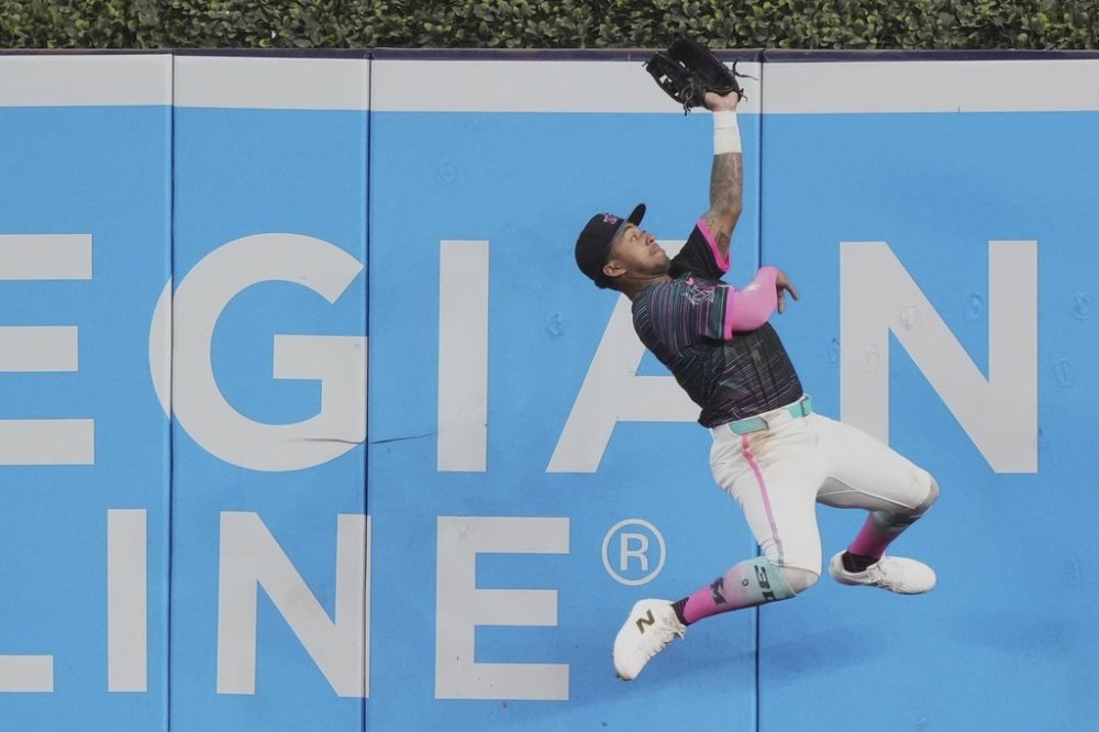 Miami Marlins right fielder Dane Myers catches a fly ball hit by San Francisco Giants' Jung Hoo Lee during the seventh inning of a baseball game, Saturday, May 31, 2025, in Miami. (AP Photo/Lynne Sladky)