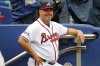 FILE - Atlanta Braves manager Fredi Gonzalez (33) smiles in the dugout prior to a baseball game against the Philadelphia Phillies, Thursday, May 12, 2016, in Atlanta. (AP Photo/Brett Davis,File)