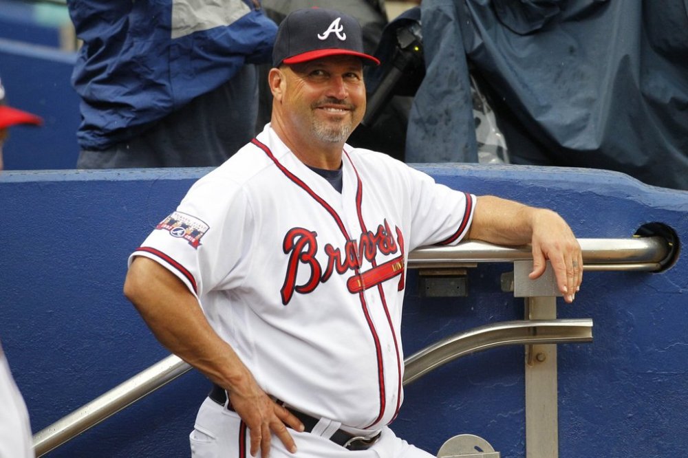 FILE - Atlanta Braves manager Fredi Gonzalez (33) smiles in the dugout prior to a baseball game against the Philadelphia Phillies, Thursday, May 12, 2016, in Atlanta. (AP Photo/Brett Davis,File)