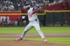 Los Angeles Dodgers pitcher Tony Gonsolin throws against the Arizona Diamondbacks during the first inning of a baseball game Sunday, May 11, 2025, in Phoenix. (AP Photo/Darryl Webb)