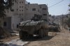 Israeli army vehicles are seen during a military operation in the West Bank city of Jenin, Tuesday, March 11, 2025. (AP Photo/Majdi Mohammed)