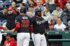 Washington Nationals' James Wood (29) is greeted by Josh Bell after scoring a run on a double hit by Keibert Ruiz against Atlanta Braves pitcher AJ Smith-Shawver during the first inning of a baseball game in Washington, Thursday, May 22, 2025. (AP Photo/Terrance Williams)