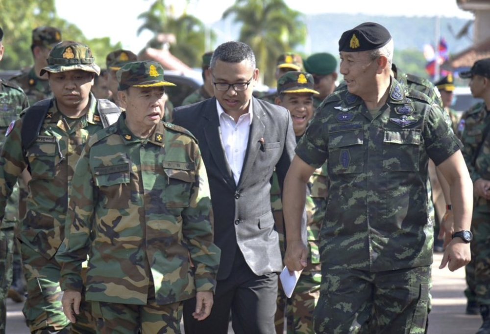 FILE - In this photo released by the Thai Royal Thai Army, Cambodian Chief of Army Mao Sophan, left, meets with Thailand Chief of Army Gen. Pana Claewplodtook, right, at a border checkpoint in Surin province, Thailand, May 29, 2025. (Thai Royal Thai Army via AP, file)