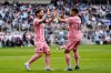 Inter Miami forward Lionel Messi, left, celebrates with defender Jordi Alba after scoring a goal during the second half of an MLS soccer match against Minnesota United, Saturday, May 10, 2025, in St. Paul, Minn. (AP Photo/Abbie Parr)
