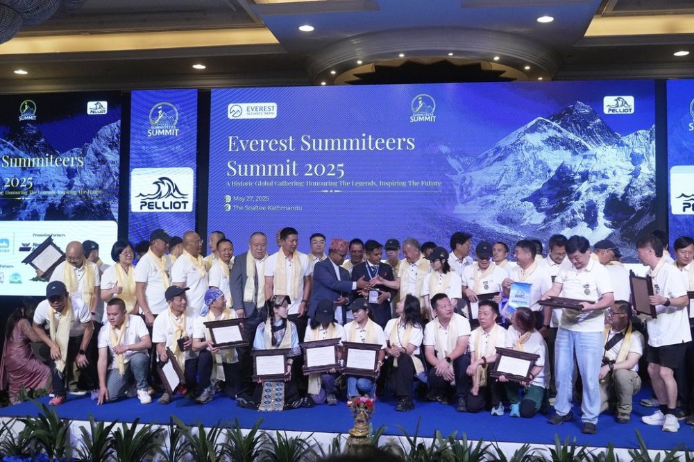 Climbers who successfully summited Mount Everest pose for a picture during the Everest Summiteers Summit in Kathmandu, Nepal, on Tuesday, May 27, 2025. (AP Photo/Niranjan Shrestha)