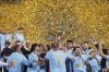 Pyramids players celebrate with the trophy after winning the CAF Champions League final second leg soccer match against Mamelodi Sundowns at the Air Defense Stadium in Cairo, Egypt, Sunday, June 1, 2025. (AP Photo)