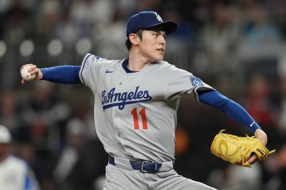 Los Angeles Dodgers pitcher Roki Sasaki (11) delivers against the Atlanta Braves in the second inning of a baseball game, Saturday, May 3, 2025, in Atlanta. (AP Photo/Mike Stewart)