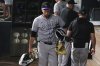 Colorado Rockies catcher Jacob Stallings (25) carries his gear as he walks from the dugout at the end of a baseball game against the Texas Rangers, Wednesday, May 14, 2025, in Arlington, Texas. (AP Photo/LM Otero)