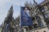 A flag with Ronaldo of Portugal waves in front of the town hall in Munich, Germany, ahead of the Nations League Finals, starting tomorrow with Germany against Portugal, Tuesday, June 3, 2025. (AP Photo/Martin Meissner)