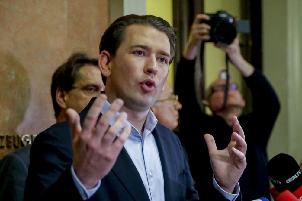 FILE - Former Austrian Chancellor Sebastian Kurz talks to media people after the verdict of his trial in Vienna, Austria, Friday, Feb.23, 2024. A judge has convicted Kurz of making false statements to a parliamentary inquiry. (AP Photo/Heinz-Peter Bader, File)