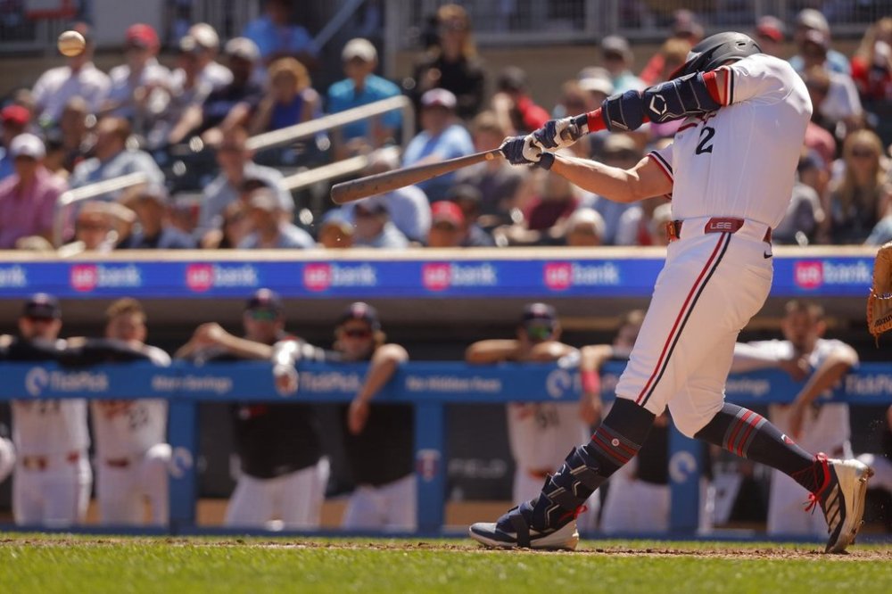 Minnesota Twins' Brooks Lee hits a two-run double against the Baltimore Orioles in the eighth inning of a baseball game Thursday, May 8, 2025, in Minneapolis. (AP Photo/Bruce Kluckhohn)