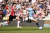 Manchester City's Erling Haaland, right, controls the ball from Southampton's Jan Bednarek during their Premier League soccer match at St Mary's Stadium, Southampton, England, Saturday May 10, 2025. (Andrew Matthews/PA via AP)