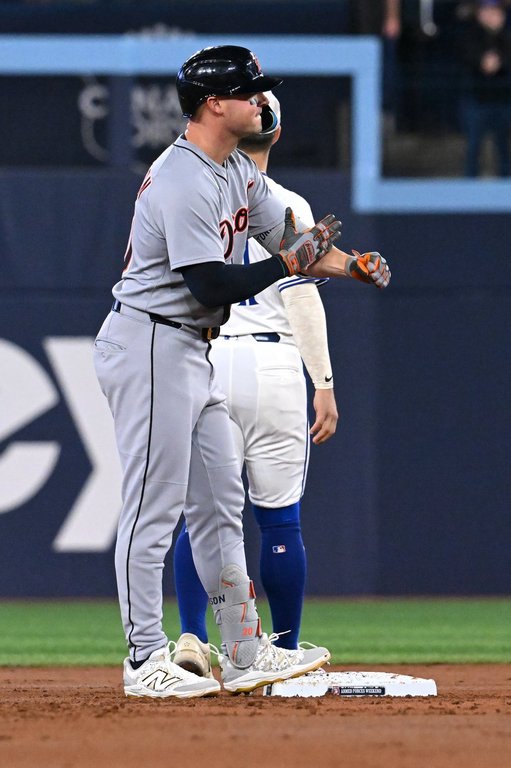 Detroit Tigers first baseman Spencer Torkelson gestures to the Detroit dugout after hitting a two-run double against the Toronto Blue Jays in first inning American League baseball action in Toronto on Sunday, May 18, 2025. THE CANADIAN PRESS/Jon Blacker