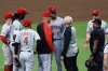 Cincinnati Reds pitcher Hunter Greene (21) is tended to after sustaining an injury while warming up during the fourth inning of a baseball game against the Atlanta Braves, Wednesday, May 7, 2025, in Atlanta. (AP Photo/Butch Dill)