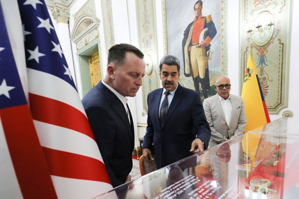 FILE - This photo released by Venezuela's presidential press office shows Venezuelan President Nicolas Maduro, center, with Richard Grenell, President Donald Trump's special envoy, left, accompanied by National AssemblyPresident Jorge Rodriguez, at Miraflores presidential palace in Caracas, Venezuela, Jan. 31, 2025. (Venezuela's presidential press office, via AP File)
