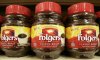 Shoppers at Loblaw Cos. Ltd.'s stores will soon no longer be able to get a Folgers brand coffee fix after a pricing dispute prompted the grocer to pull it from its shelves. In this June 4, 2008 file photo, containers of Folgers instant coffee are seen on a supermarket shelf in Norwood, Mass. (AP Photo/Steven Senne, file)