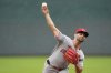Cincinnati Reds starting pitcher Nick Martinez throws during the first inning of a baseball game against the Kansas City Royals, Monday, May 26, 2025, in Kansas City, Mo. (AP Photo/Charlie Riedel)